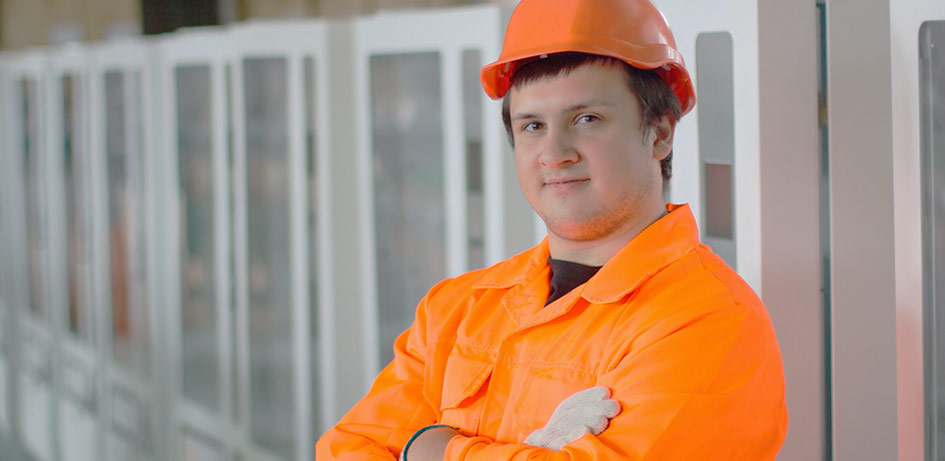 man standing by vending machines for industrial supplies