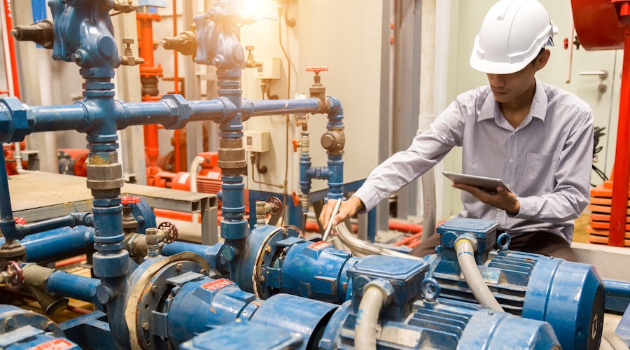 engineer maintenance checking technical data of system equipment Condenser Water pump and pressure gauge , water pump.